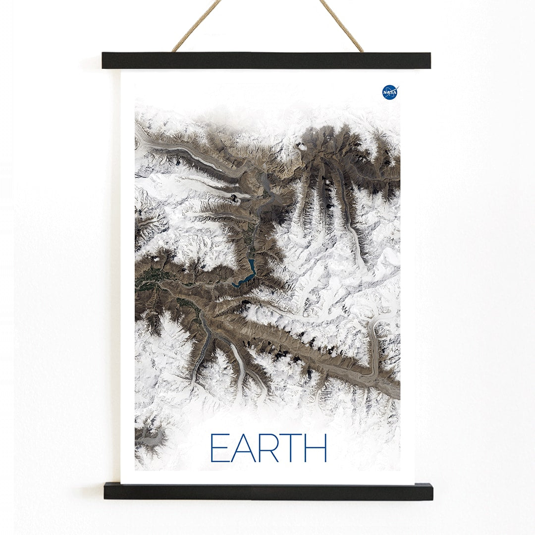 Stunning NASA satellite image of Earth showing snowy mountain ranges and rugged terrain high resolution poster, with wooden magnetic frame on white background