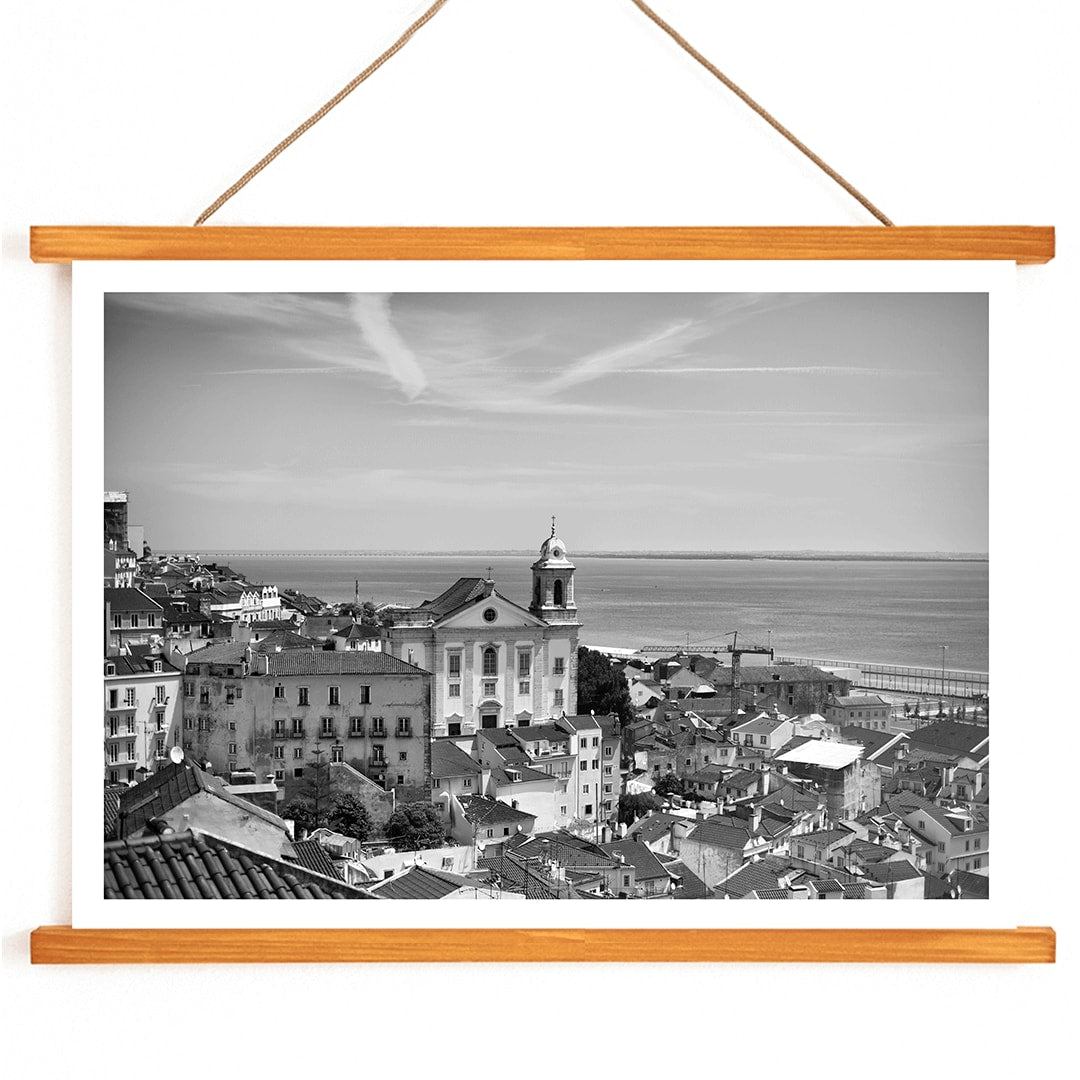 Lisbon Old City Landscape Black and White Picture 1 showing historic buildings rooftops and ocean view waterfront poster, with wooden magnetic frame on white background