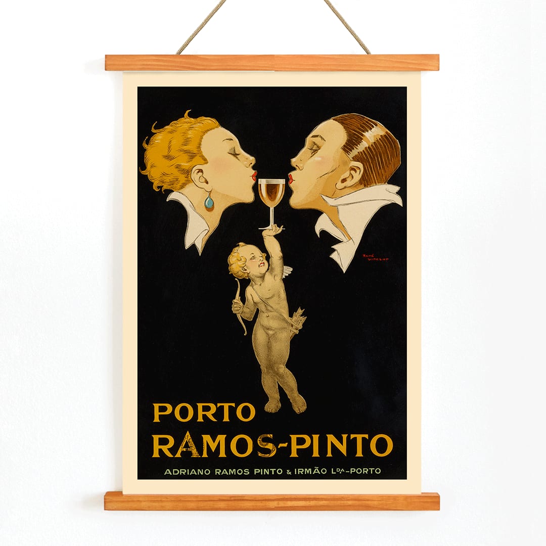Porto Ramos-Pinto poster by Rene Vincent with two people about to kiss and a cherub holding a wine glass, with wooden magnetic frame on white background