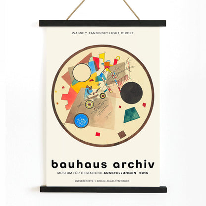 Abstract geometric artwork Light Circle by Wassily Kandinsky from Bauhaus exhibition poster displayed at Bauhaus Archiv Museum, with wooden magnetic frame on white background