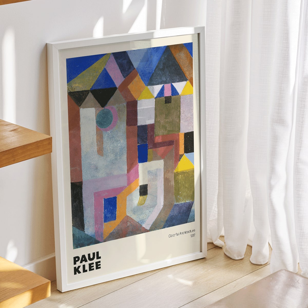 Colorful abstract geometric art poster by Paul Klee titled Colorful Architecture featuring vibrant shapes and colors, framed and displayed in modern living room decor