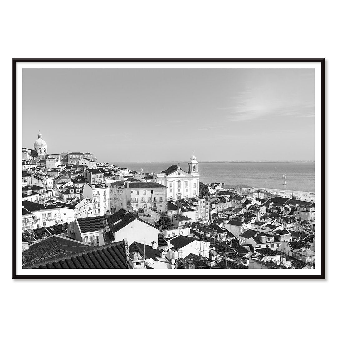 Black and white landscape poster of Alfama Lisbon Old City with traditional buildings and Tagus River by artist Alfama Lisbon, with black aluminium frame on white background