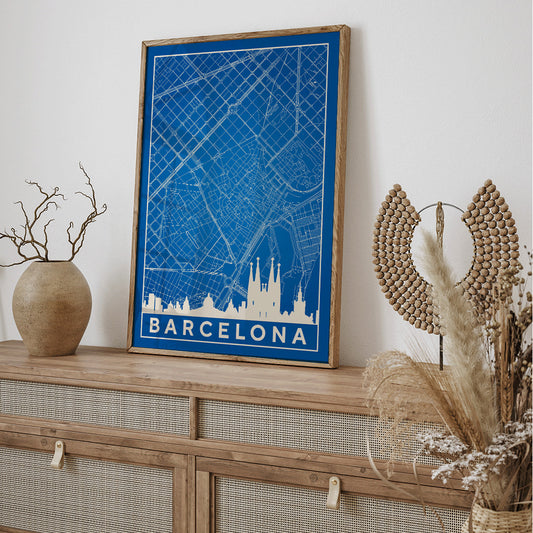 Minimalist blue and white map of Barcelona by Moryarty featuring iconic landmarks street layout and skyline poster titled Minimalist Map of Barcelona 2, framed and displayed in home decor