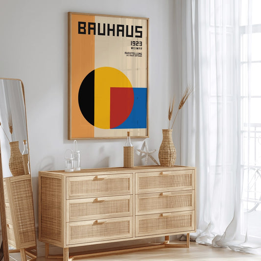 Bauhaus Poster 1 inspired by the Weimar Exhibition featuring geometric shapes in warm bold colors and modernist design style, framed and displayed in home decor