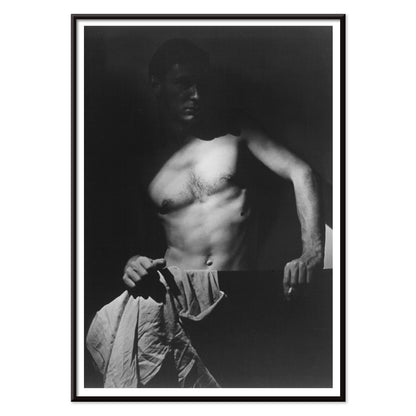 Shirtless man holding towel in dramatic lighting Max After Surfing by Olive Cotton wall art photography poster, with black aluminium frame on white background
