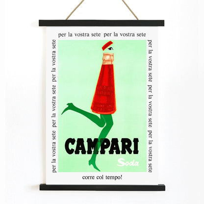 Campari Soda advertising posters by Franz Marangolo and Leonetto Cappiello featuring stylized bottles with green legs and walking on a green background, with wooden magnetic frame on white background