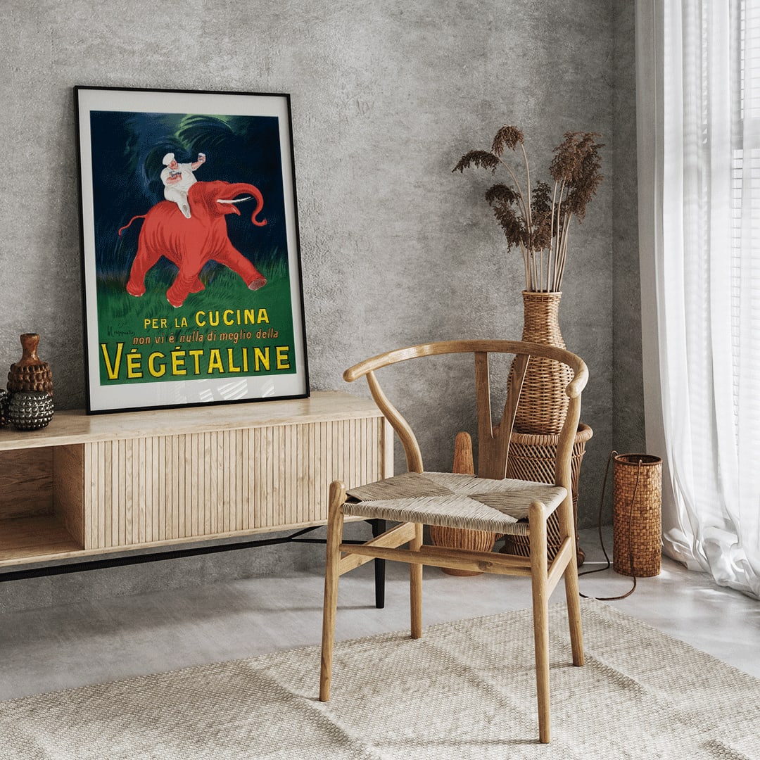 Vintage poster of chef riding a red elephant with bold Vegetaline text artwork by Leonetto Cappiello vibrant style, framed and displayed in home decor