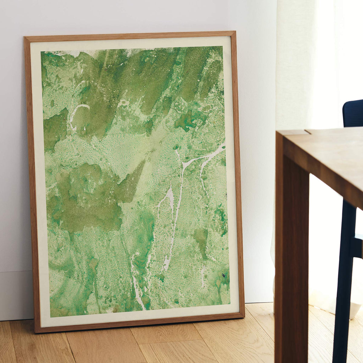 Margarete Rumpf Green marbled paper poster with swirling green and pale beige abstract textures vertical composition, framed and displayed in modern living room decor