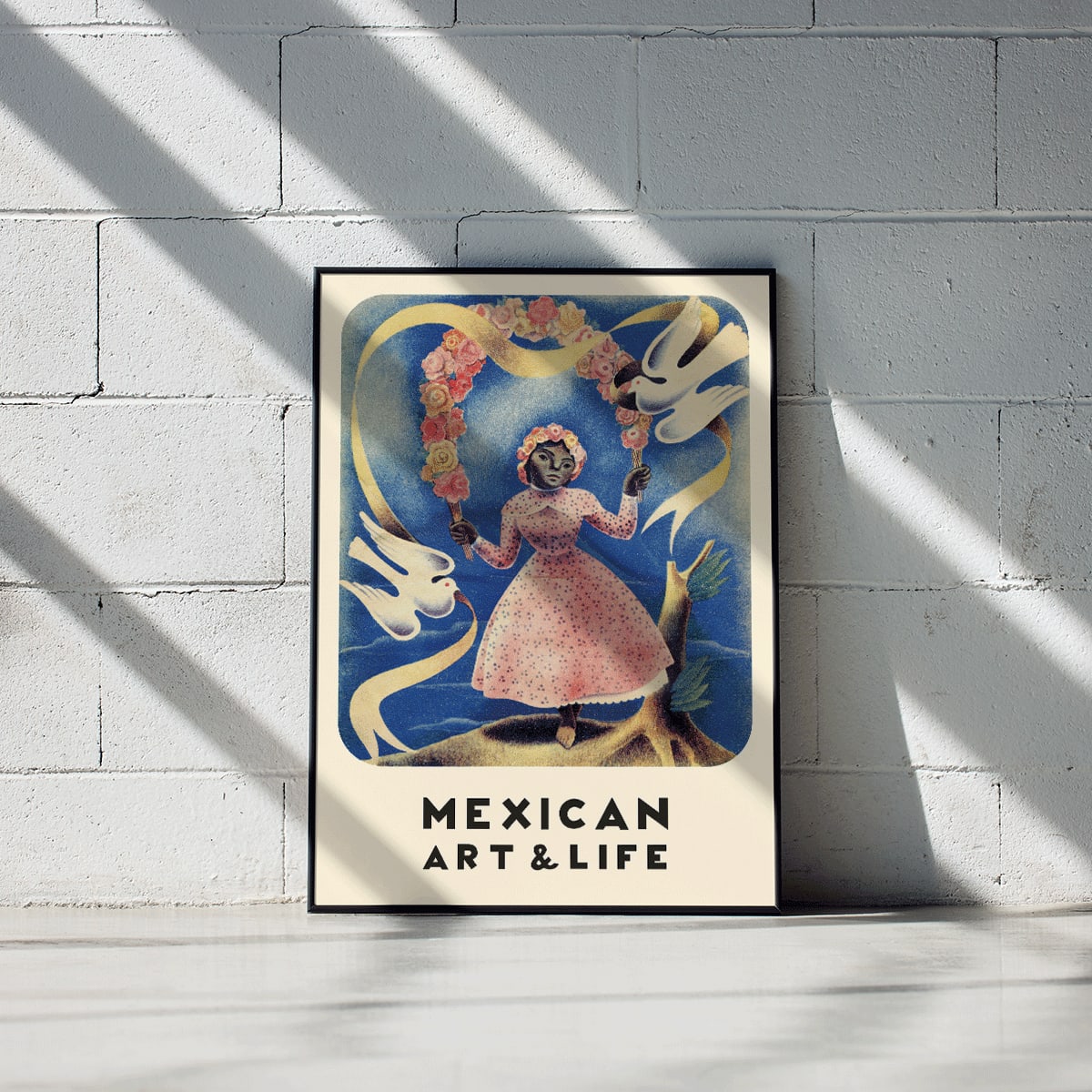 Mexican Art and Life cover and poster by Diego Rivera featuring a girl in a pink dress with floral crown and two white doves, framed and displayed in modern living room decor