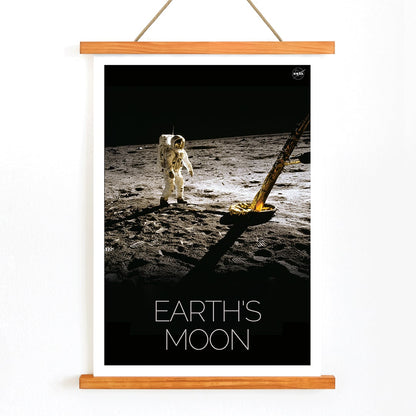 Astronaut on the lunar surface with text Earths Moon Man on Moon 2 by NASA poster, with wooden magnetic frame on white background