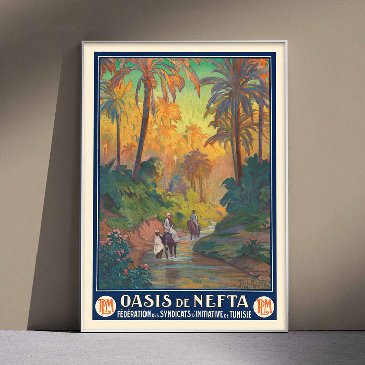Oasis de Nefta poster by Joseph de La Nézière with lush palm oasis, warm sunset light, figures and winding stream, with wooden magnetic frame on white background