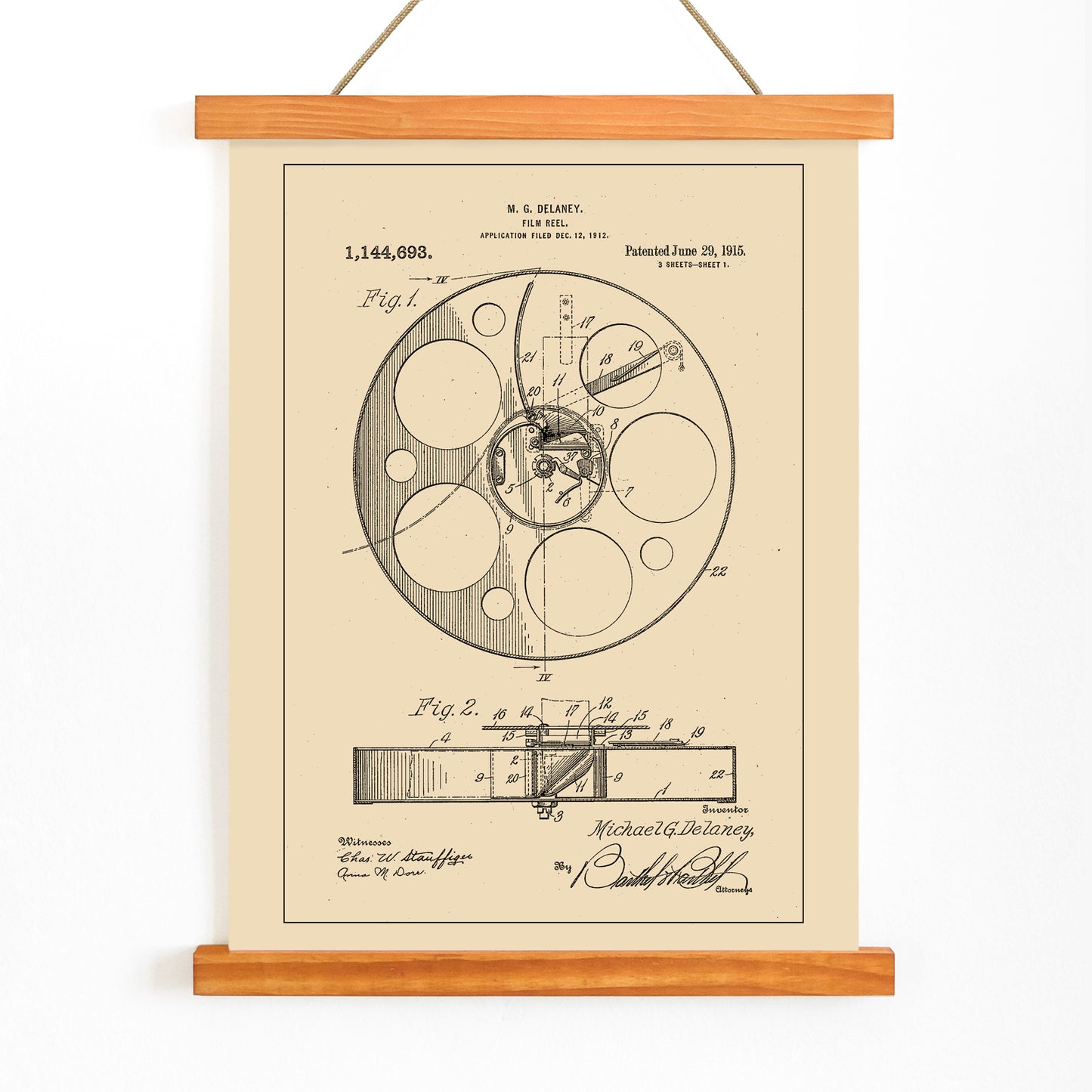 Vintage film reel patent illustration and schematic artwork by M G Delaney for wall art decor, with wooden magnetic frame on white background