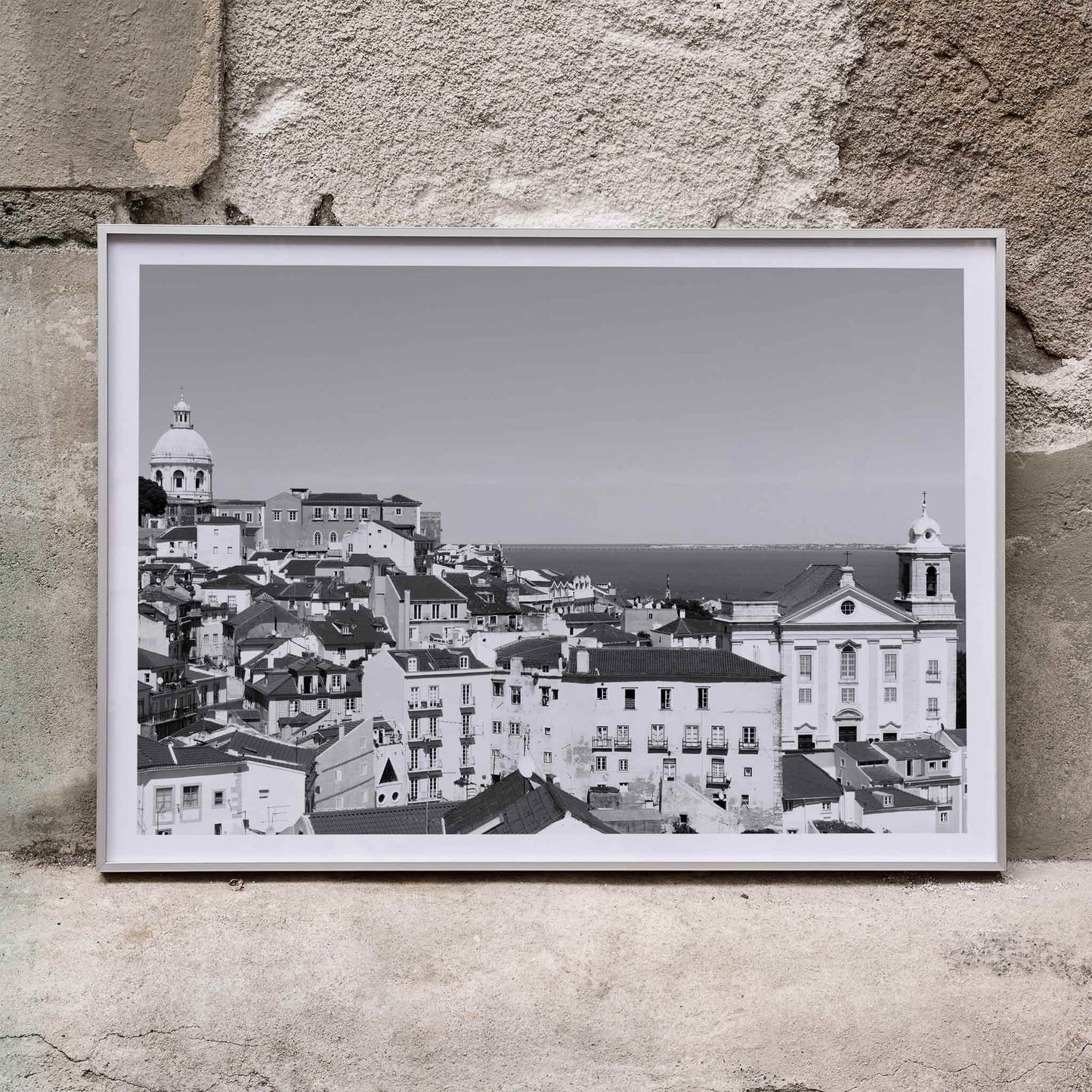 Black and white landscape of Lisbon Old City with historic architecture rooftops and distant sea view poster by Picture 2, framed and displayed in home decor