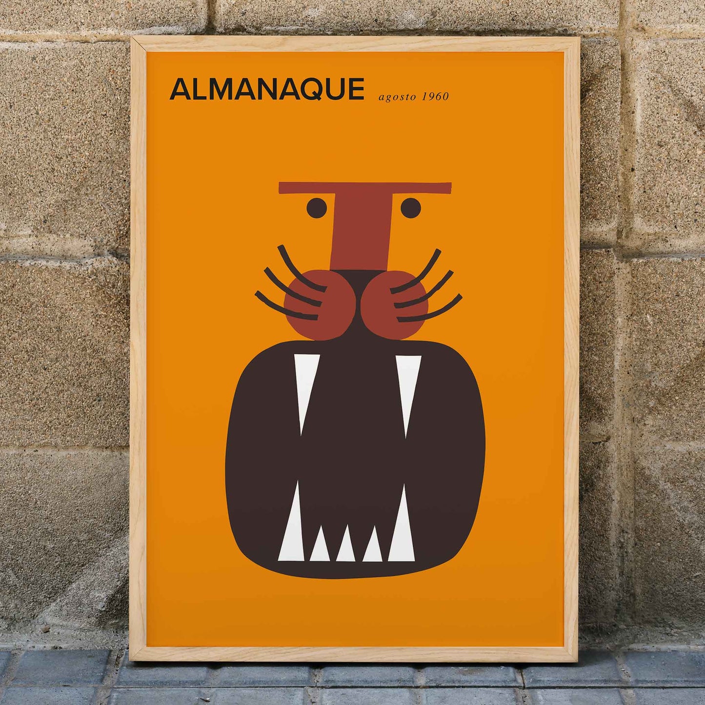 Almanaque magazine cover by Sebastiao Rodrigues with abstract animal and face artwork on orange background, framed and displayed in home decor