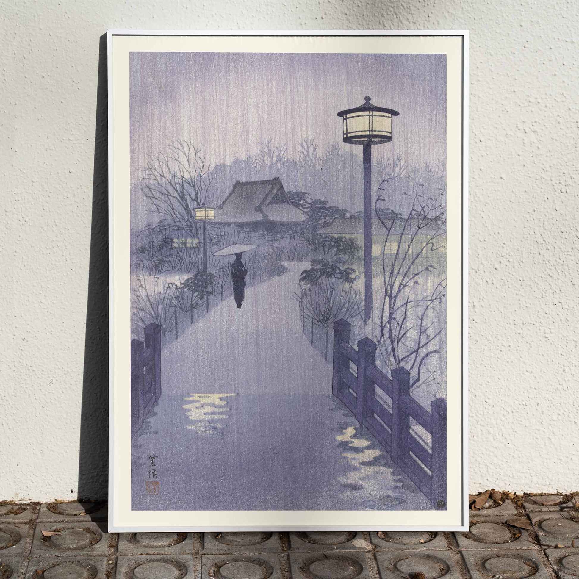 Rainy evening at Shinobazu pond by Kasamatsu Shiro with a person holding an umbrella near a lamppost serene scene artwork poster, framed and displayed in home decor