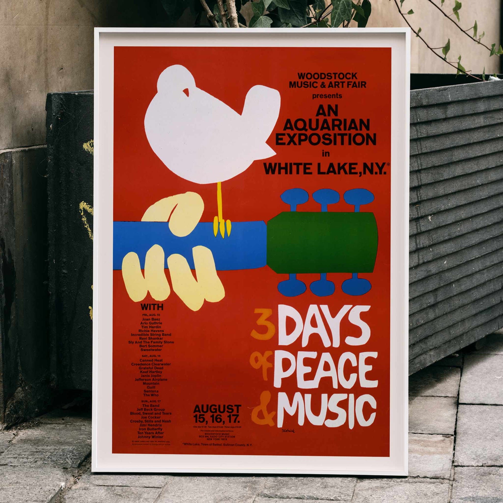 Woodstock poster with white dove on guitar promoting peace and music at An Aquarian Exposition in White Lake artist unknown, framed and displayed in home decor