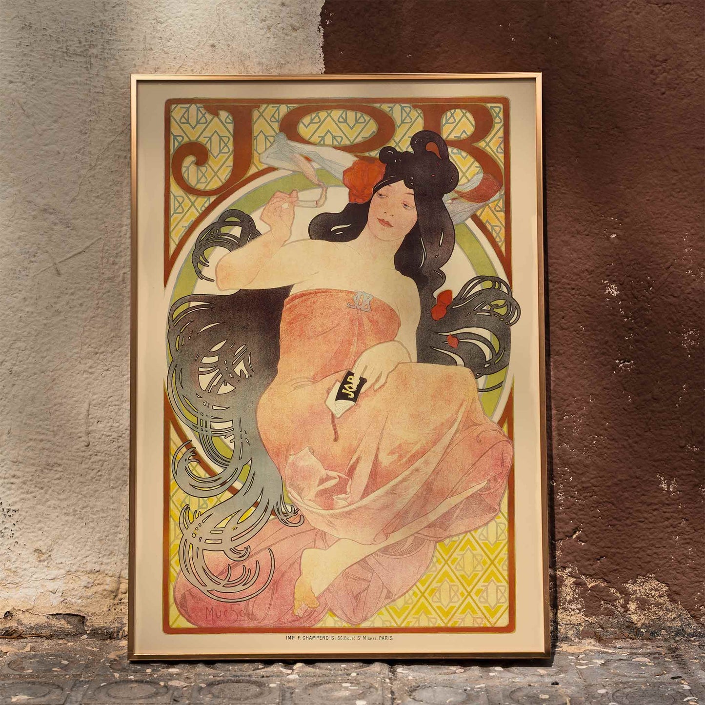Art Nouveau poster by Alphonse Mucha featuring an elegant woman in a flowing dress with dark hair titled Job, framed and displayed in home decor