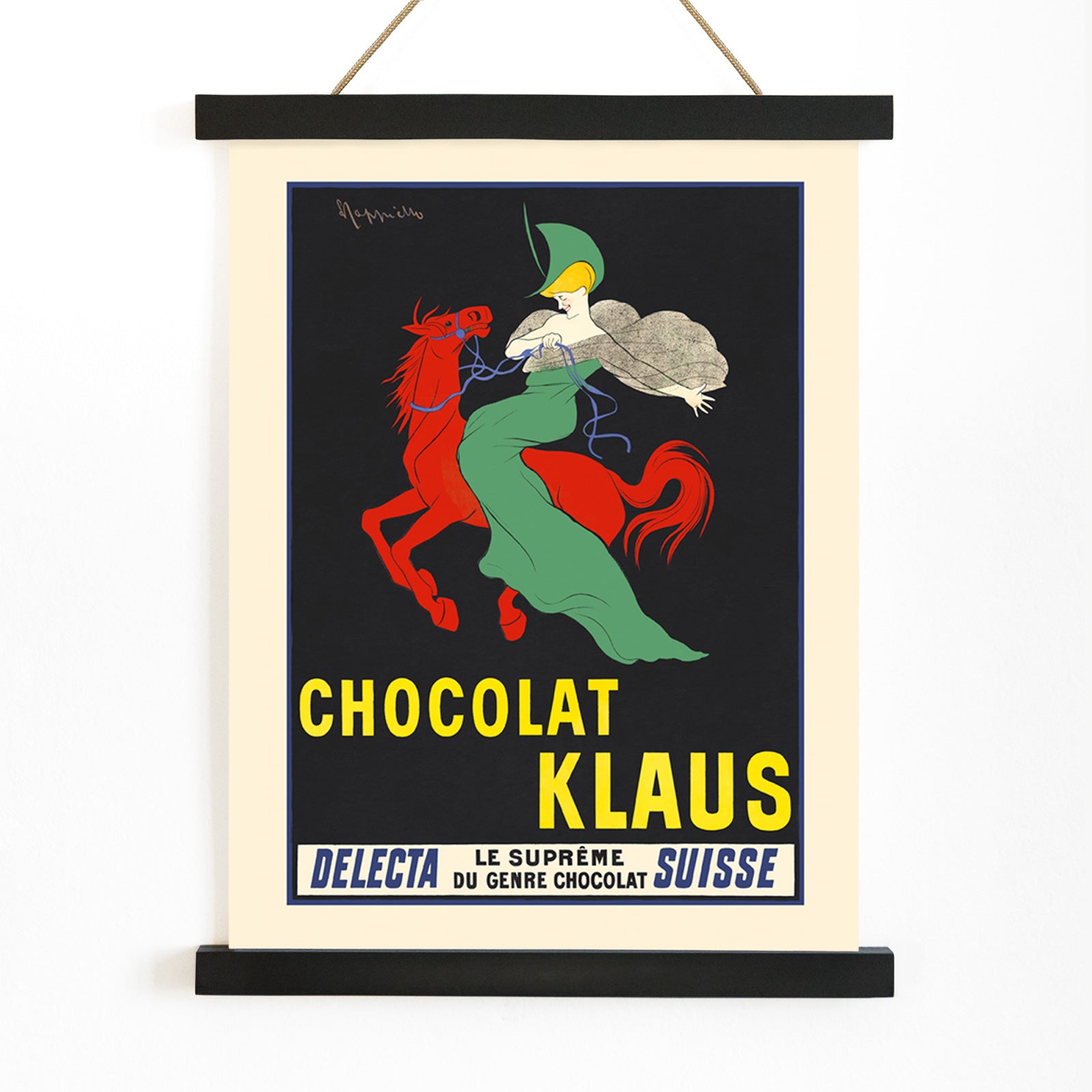 Chocolat Klaus poster by Leonetto Cappiello showing a woman in a flowing green dress riding a red horse on a black background, with wooden magnetic frame on white background