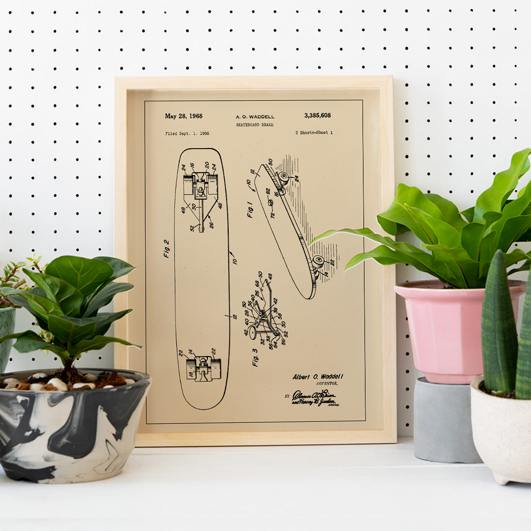 Technical illustration and poster of skateboard brake concept by artist A O Waddell titled Skate Board Brake Patent featuring labeled technical drawings for wall decor, framed and displayed in home decor