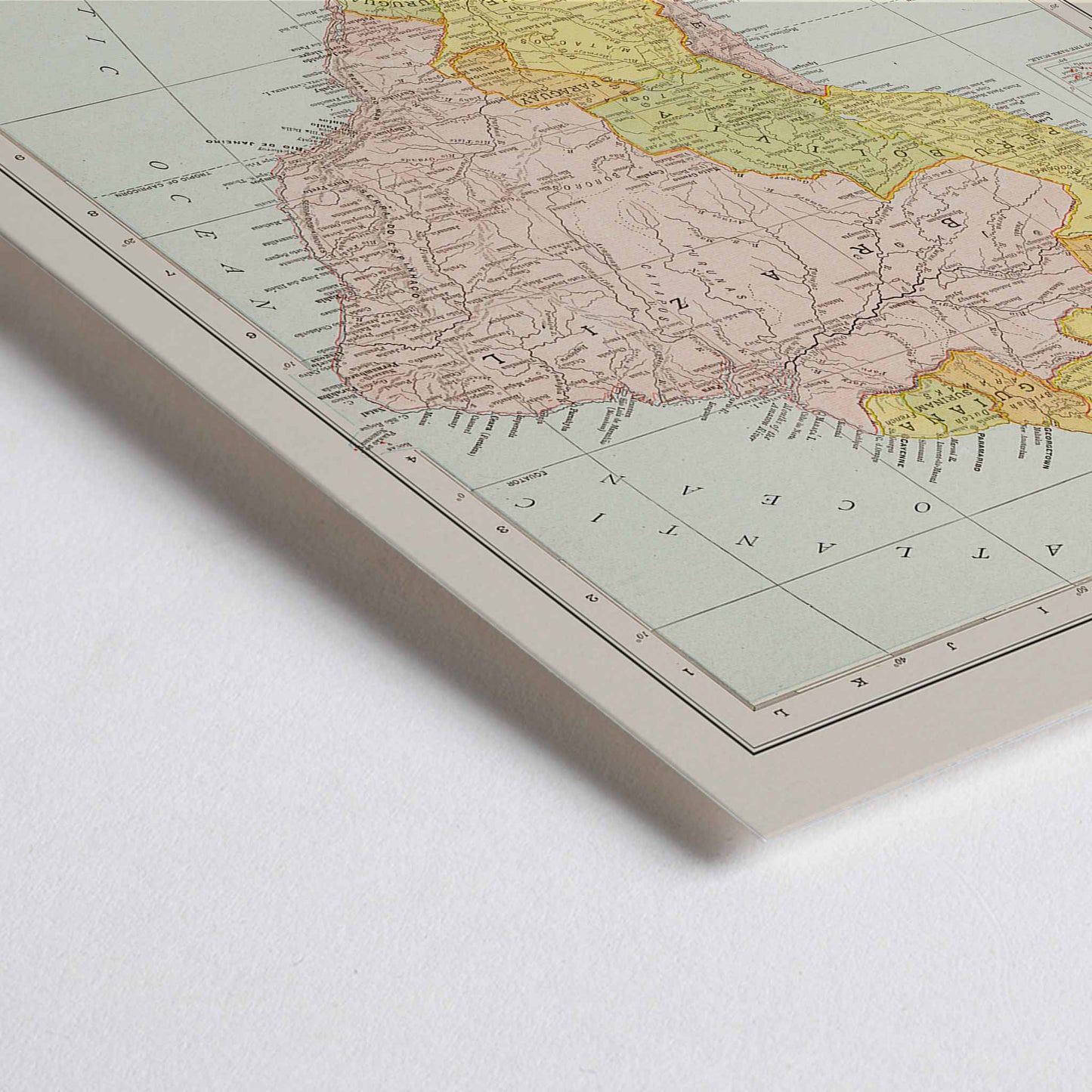 Closeup detail of Vintage Rand McNally South America map poster with labeled continent in soft yellow pink and beige cartographic detail