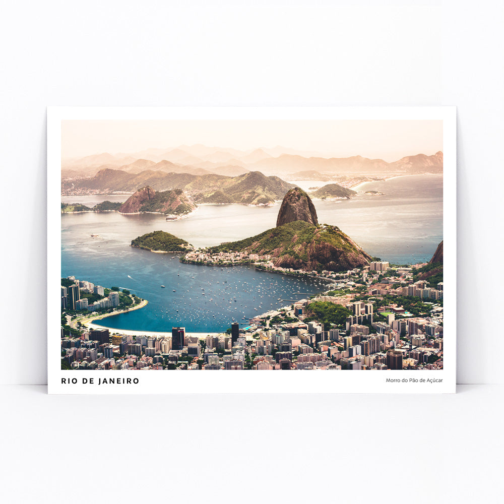Aerial view of Rio de Janeiro with beaches buildings boats blue waters and mountains including Morro do Pao de Acucar poster artwork, framed and displayed in modern living room decor