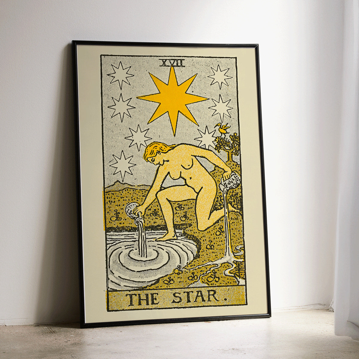 The Star tarot card by Lauron William de Laurence showing a woman pouring water from jugs under a starlit night sky tarot poster, framed and displayed in modern living room decor
