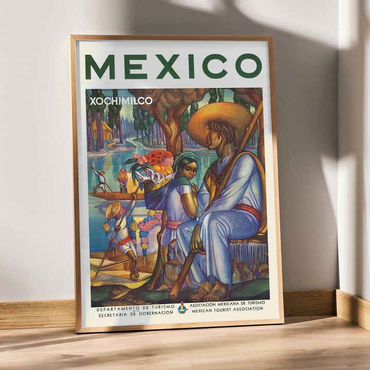 Xochimilco poster with canal boats, flower vendors, and local travelers beneath trees in vivid green, blue, orange, and red, with wooden magnetic frame on white background